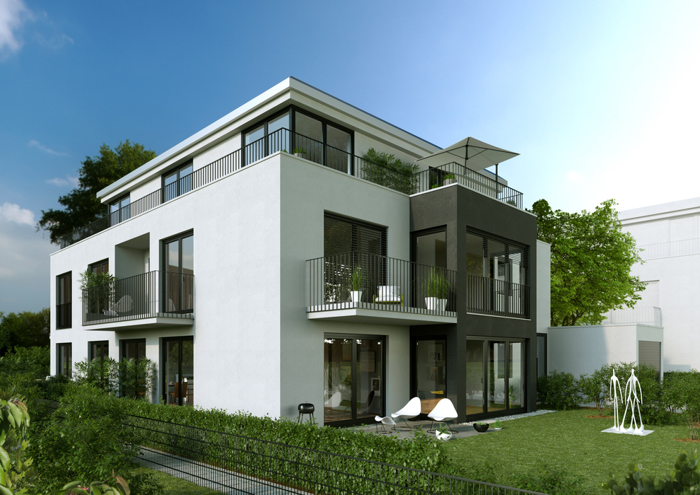 Hausansicht des Wohnbauensemble mit vielen Fensterelemente, Balkone, Wintergarten und der Gartenbereich